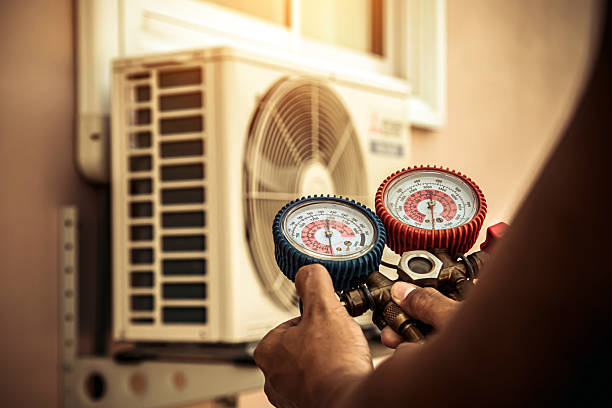 Professional Hvac technician working in Rogersville, AL